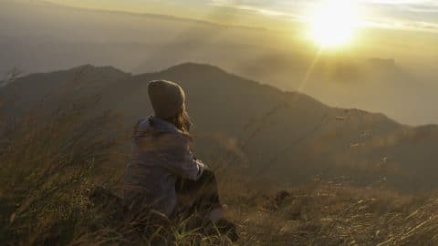 Lifestyle traveler happy feeling good relax and freedom facing in the sunrise morning Travel Concept