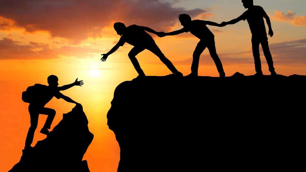 Teamwork friendship hiking help each other