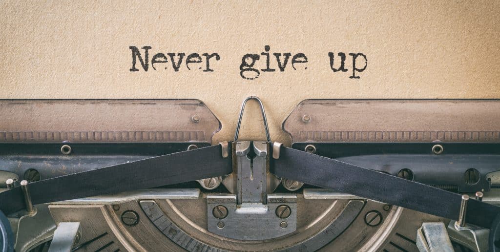 Vintage typewriter Never give up